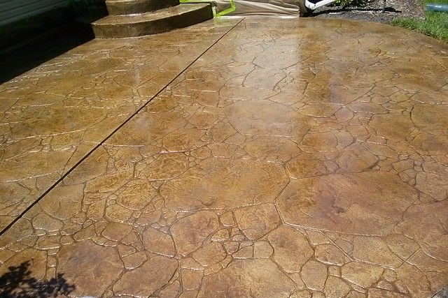 A stamped concrete patio with steps and steps.