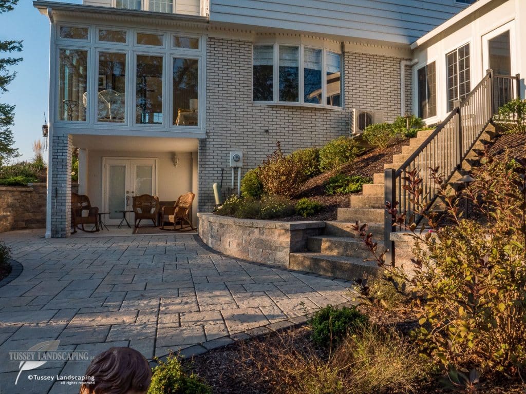 A home with a stone patio and steps.