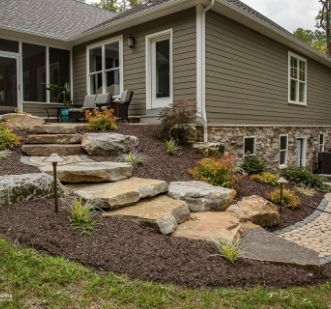 A home with a stone walkway and landscaping.