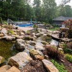 Large waterfall with landscaping and pond