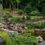 waterfall with pond and landscaping and hardscaping