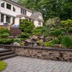 paver patio with landscaping and hardscaping