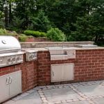 outdoor kitchen with paver patio