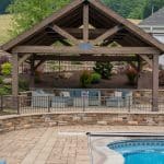outdoor living space with pool, patio, pergola, pavilion, hot tub, pond
