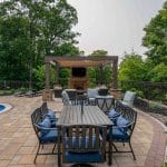 outdoor living space with fiberglass swimming pool, pergola, and paver patio with outdoor seating