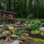 landscaping with mountain boulders and pergola