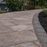 paver sidewalk with mulch landscaping
