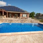 fiberglass swimming pool, spa hot tub, with hardscaping and paver patio