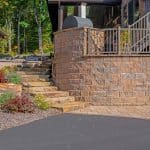paver driver way with retaining wall and natural stone stairs