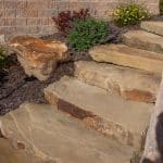 natural stone stairs with landscaping