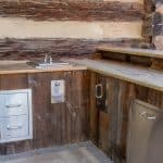 outdoor kitchen with granite counters and stainless steel appliances