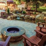 paver patio with firepit and pond