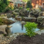 pond water feature with mountain boulders