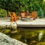 paver patio overlooking a pond