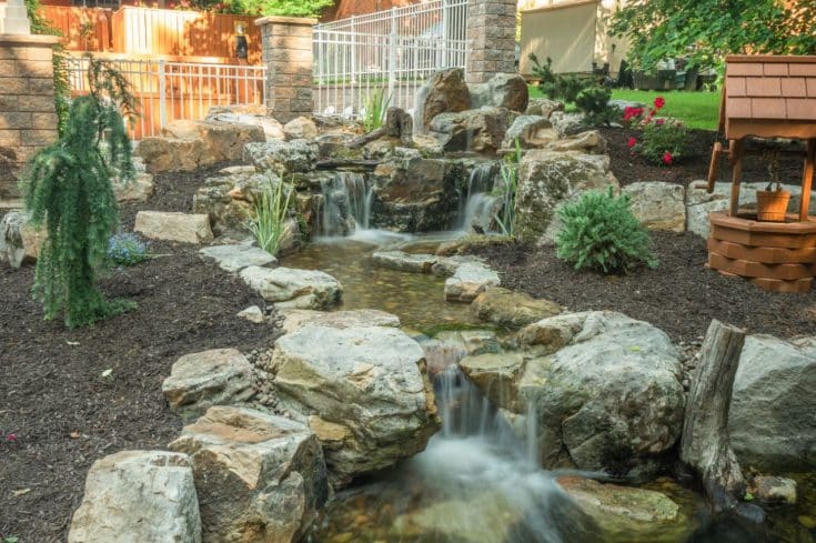 Backyard Water Features with Pond, Waterfalls, and Patio in Delmont, PA