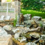pond water feature with mountain boulders and waterfalls