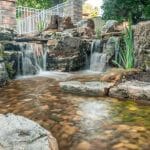 pond water feature with mountain boulders and waterfalls