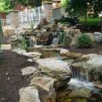 pond water feature with mountain boulders and waterfalls
