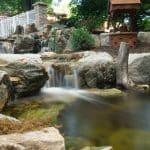 pond water feature with mountain boulders and waterfalls