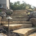 black hills natural stone stairs with boulders and landscaping
