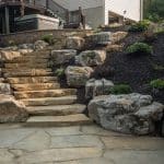 black hills natural stone stairs with boulders and landscaping