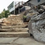 black hills natural stone stairs with boulders and landscaping