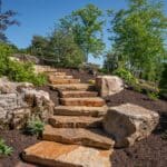 blackhills stone natural stone stair case with mountain boulders and landscaping