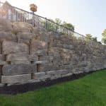large retaining wall with landscaping