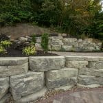large retaining wall with landscaping