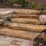paver patio with landscaping, low voltage led lighting, landscaping and retaining wall