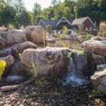 boulders with a water feature and pond