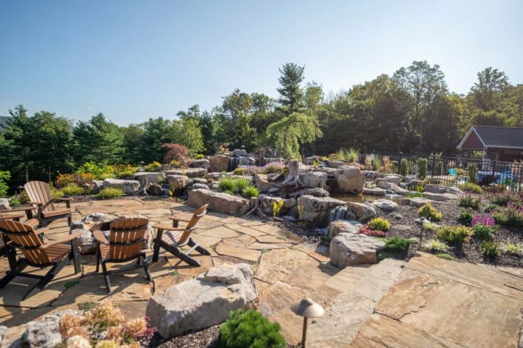 Flagstone Patio Outdoor Living Space with Large Water Feature and Firepit in Port Matilda, PA