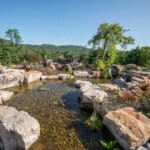 boulders with a water feature and pond