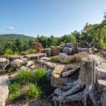 boulders with a water feature and pond