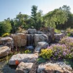 boulders with a water feature and pond