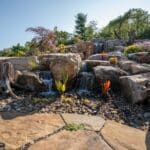 boulders with a water feature and pond