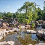 boulders with a water feature and pond