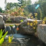 boulders with a water feature and pond