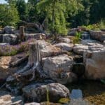 boulders with a water feature and pond