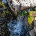 boulders with a water feature and pond