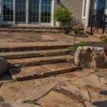 natural stone stairs with flagstone patio