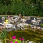 pond with waterfall and landscaping