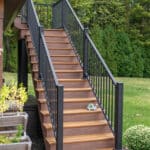 Outdoor living space with patio, pavilion, pond, and landscaping