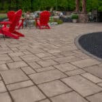 Outdoor living space with patio, pavilion, pond, and landscaping