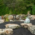 pond with waterfall and landscaping