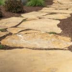 mulch planting bed with flagstone walk way