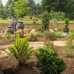 mulch planting bed with flagstone walk way