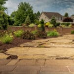 mulch planting bed with flagstone walk way