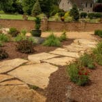 mulch planting bed with flagstone walk way