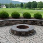 paver patio with seating wall and fire pit